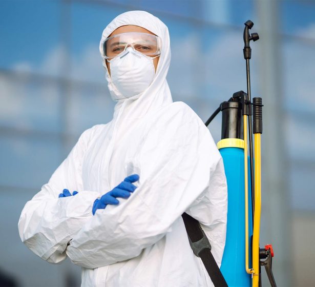 disinfecting-to-prevent-covid-19-man-in-protectiv-2025-03-05-05-32-49-AYUVLQG.jpg